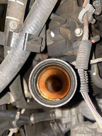 This is the inside of my oil tube.. the oil cap looks the same but kind of dried.. recently I checked my dipstick and saw bubbles and little bit of white stuff at the tip.. I haven’t had any engineer overheating, nor leaks, or loss of coolant! But I’m just curious on what is going on? I have a 2006 chevy tahoe 5.3 with 308k miles.. I recent had a code p0128 pop up! I do notice that the engine temp gauge in the car reads between 160 and 210!
