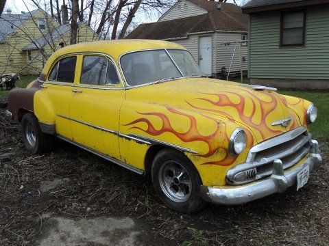 I have no idea why the back of the car is brown. The trunk lid is Yellow like the rest of the car, though