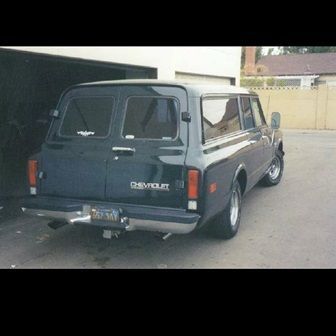 my old burb in 1996 after it was painted, note the late model bumper mod