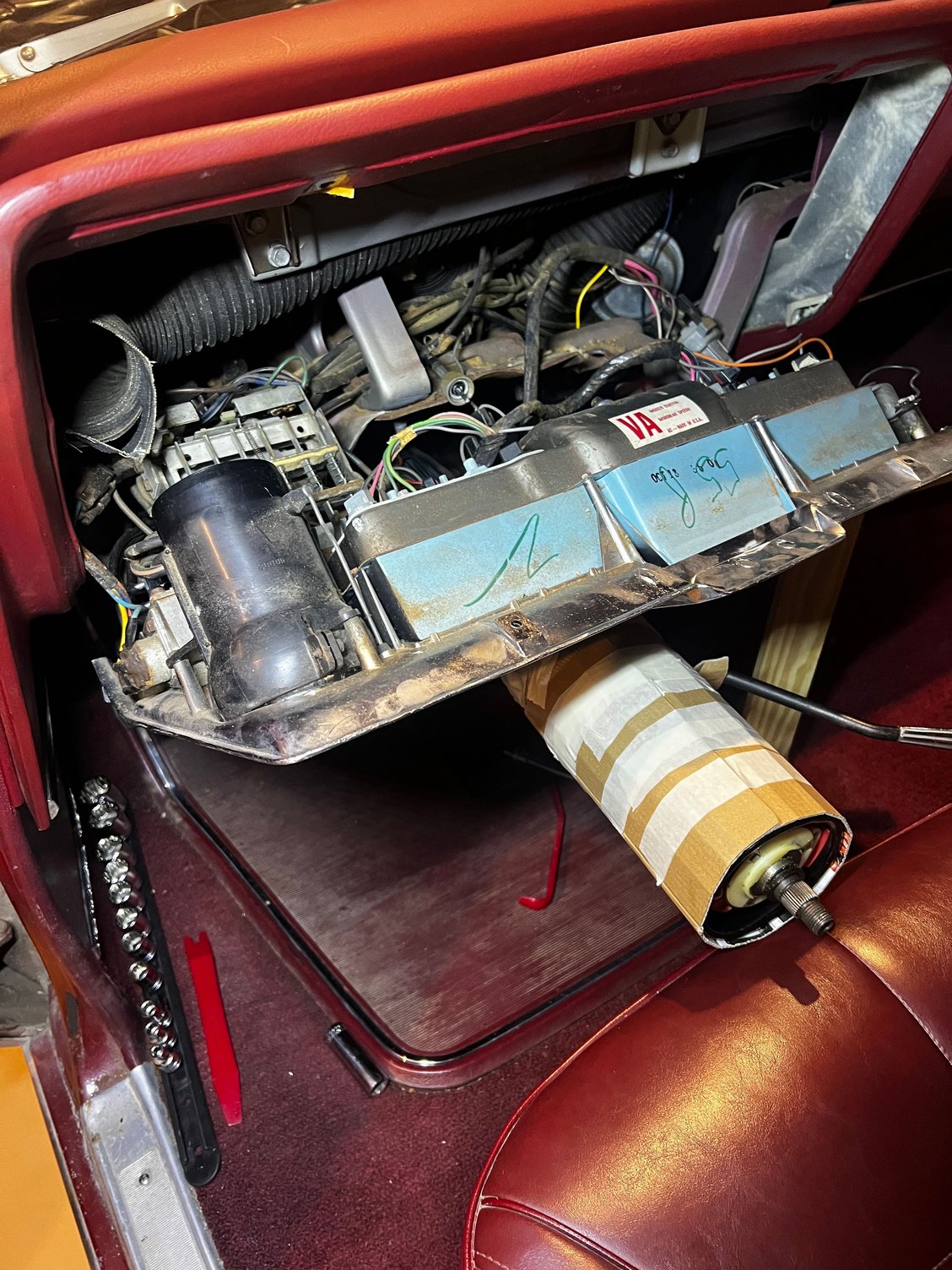 Upper screws removed, lower bolts removed, panel resting on the column. You can reach most connections from here, but several are completely blind. All are 1/4� hex head. 