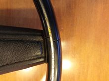 1972 Steering Wheel. Small Crack in side of wheel. Silver underlay completely intact. Clear overlay is yellowed and cracked with age.