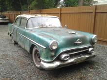 1954 Oldsmobile and friend