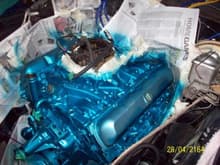 Always paint the valve covers last,,you can still see the lighter blue color on them here.