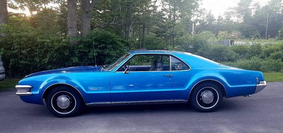 3M Gloss Blue Fire vinyl wrap. My Son couldn't near afford the price of a proper paint job, but the great thing is the original color (Nassau Blue Iridescent) is still under there.