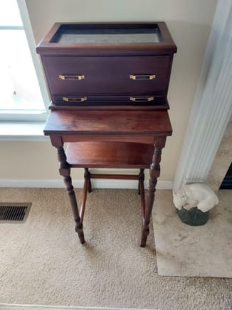 Antique phone table with the chess set