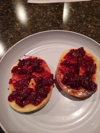 Last night's mid-evening snack, and will be again tonight.  Toasted bagel halves with lots of real butter and Raspberry jam!