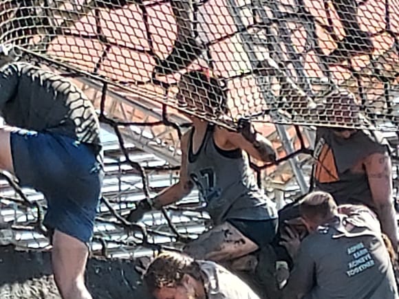 My wife waiting for my daughter to get down on the back side of the rope ladder so they could help each other down the final section of vertical wall.