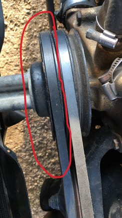 So the belt that’s circled in this picture not the alternator belt is loose and has a lot of slop in it How would I go about tightening it 