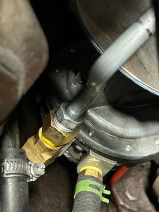 The cavity behind that steel 3/8 fuel line is where I suspect oil coming out of.