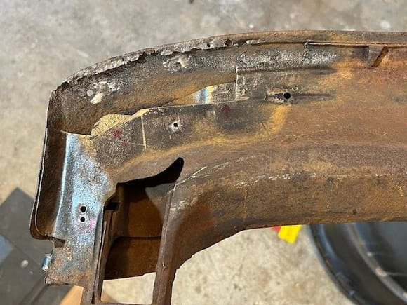 I cut away the rusty metal with a 4-1/2 cutoff wheel and dremel tool.