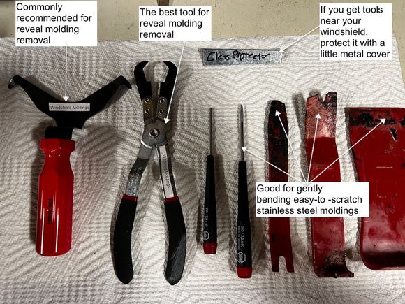 Tools to pop GM windsheild (and rear window) molding clips. Use a bending tool on the right to create a gap for the pliers or Y hook on the left and pull the clip toward the center of the windshield. 