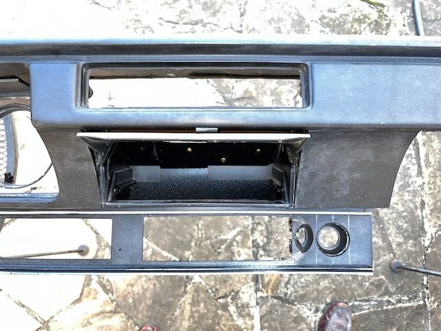 I modified my dash to move the cig lighter below the map light and center the radio a bit.  Also removed the ashtray and made the compartment big enough to hold my i-phone.