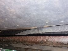 Cant  tell which is brake line....corroded line or metal line?