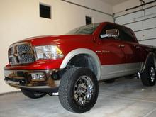 My 2009 Dodge Ram 1500 Laramie Crew 4X4 with Hemi - LIFTED with 6-inch Pro Comp Stage 1 suspension system; parked in the garage.