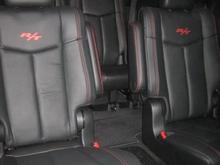 View of captains chairs from front passenger seat.