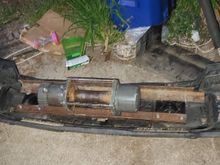 My plan is to replace the factory bumper studs with 5/16 Grade 8 Hardware and some Very thick washers. 

I still need to make the bars that will tie back to the factory tow hook bolts top and bottom. 