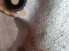 Its shaped like its counter sunk. Depth is probably around an inch or inch and a quarter (just to give some perspective). The hole at the bottom is smaller diameter then the diameter at the face (like something that is counter sunk or something).
