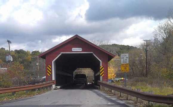 A lady took this photo of us on a covered bridge in Vermont