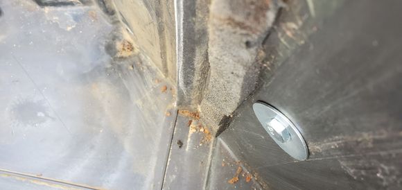 The head of my fix - 1/4-20 screw, 1.5" long, with a fender washer on it.