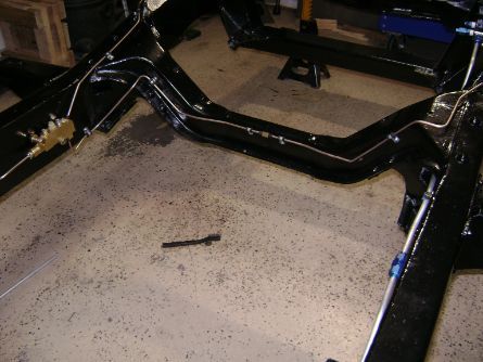 I split the line going across the frame. In case something happens, itll be easier to remove and replace. Yes that is a double flair union, not a compression fitting. 