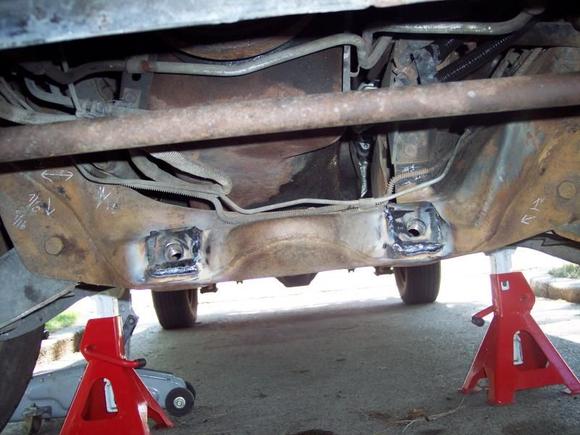 Finished repair of attachments done by in driveway by a welder with a truck having a generator and welding unit.  Parts used were the Chrysler Recall Campaign #688, which was new bolts and washers, large nuts and reinforcing plates.  Reinforcing plates are visible welded on outside of crossmember.