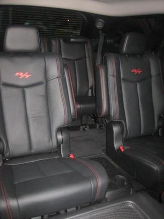 View of captains chairs from front passenger seat.