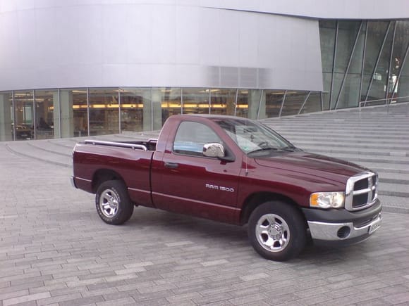 in front of the mercedes museum