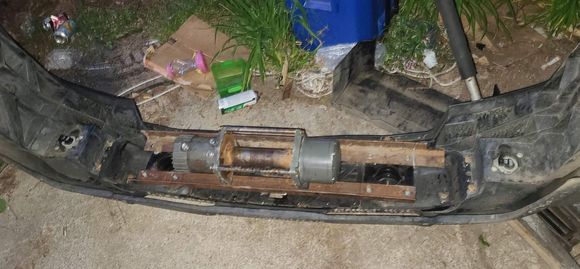 My plan is to replace the factory bumper studs with 5/16 Grade 8 Hardware and some Very thick washers. 

I still need to make the bars that will tie back to the factory tow hook bolts top and bottom. 