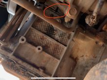 Area circled in RED appears to be where coolant is leaking. Anyone know what that area is. It was tough to get a picture but it almost looked like it may have been dented… maybe by a rock or road debris??  