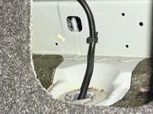 The bolt near by left rear seat area seems causing the squeaky or metallic popping noise, but i couldn’t find no nuts to tighten it… is it the bolt holding gas tank??