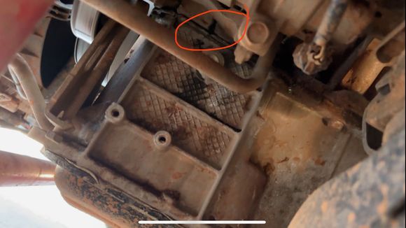 Area circled in RED appears to be where coolant is leaking. Anyone know what that area is. It was tough to get a picture but it almost looked like it may have been dented… maybe by a rock or road debris??  