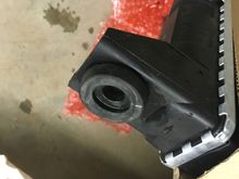 Some upper radiator bushings from a 2000 GM pickup radiator fit right in! That will be the top.