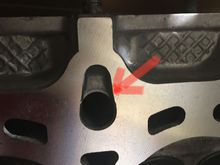 Notice there isn’t a separate path for oil to flow into. Although in the block, there is a separate path for the oil flowing upwards, it looks like the oil would hit the material and go around the bolt. But of course there is a washer on top of the bolt, so the oil must flow to the side.