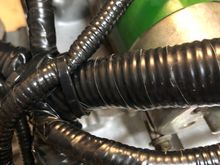 I know it’s (still) a nest. My goal wasn’t a “tuck”. But it’s been CLEANED reloomed taped and reinstalled. I added a little extra close to connectors knowing they’re getting brittle.