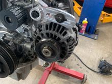 My buddy whipped out this quick alternator upper bracket. Turned out nice, the stock steel one was 1/2lb, this one barely registered on his scale. 