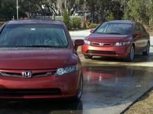 Mine and my other friend's Si's.  His is an exact duplicate of mine.  07 Sedan, Navi, Habanero Red, Summer Tires, etc