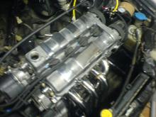 The valve cover looked pretty dirty and it had some paint chipping off so I removed the paint and polished it partially.