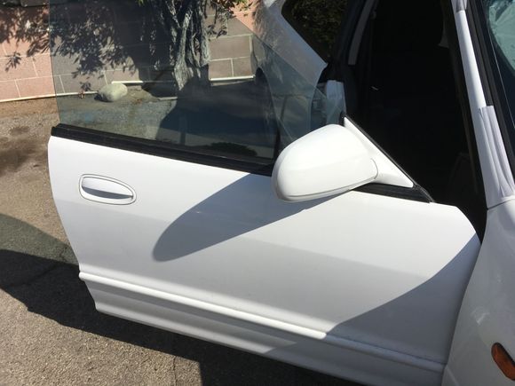 Acura Integra 
Right Front Door 
Sedan 94-01
Original Frost White paint (94-98 white)
$100
Includes door shell, both hinges, weather stripping, glass, regulator, exterior moldings, and wiring harness.
Mirror is sold 
Speaker is sold
Latch is sold 
Exterior handle is sold