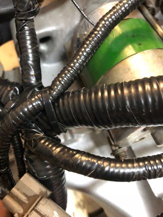I know it’s (still) a nest. My goal wasn’t a “tuck”. But it’s been CLEANED reloomed taped and reinstalled. I added a little extra close to connectors knowing they’re getting brittle.