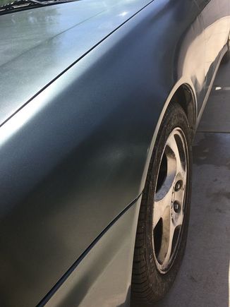 Freshly painted fender. Still has some wax residue.