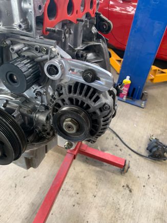 My buddy whipped out this quick alternator upper bracket. Turned out nice, the stock steel one was 1/2lb, this one barely registered on his scale. 