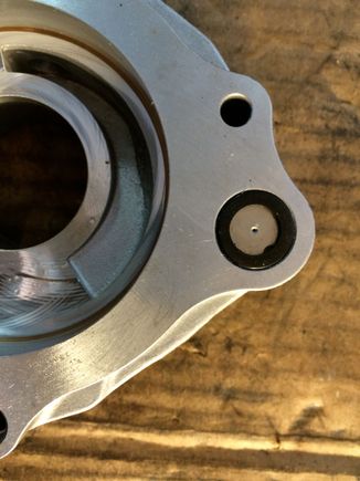 This is the regulating orifice on the "middle" plate for fluid entering the piston housing.