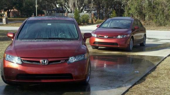 Mine and my other friend's Si's.  His is an exact duplicate of mine.  07 Sedan, Navi, Habanero Red, Summer Tires, etc