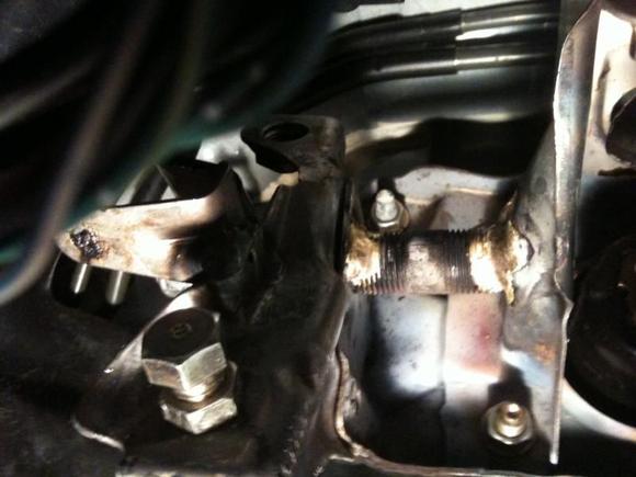 This show's the home-fix to the clutch pedal pivot.  I used a small piece of pipe, through-which is running a 7/16 diameter bolt.  We decided to braise it together instead of weld, because the old arc welder we have just blows through the stamped sheet metal.  I then used a small piece of tubing as a bushing for the pedal itself to pivot on.  
Unfortunately, the bolt still wasn't strong enough and the damn thing broke again after a year of use.  I'm going to attempt to reinforce it even more with some square tubing.  I will post updates as I go along.