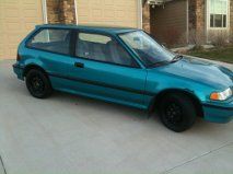 when i first got the car. took off the hub caps. no tint, no rear view mirror, completely stock.
