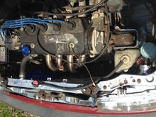 Top end reinstalled with the new stainless exhaust manifold and the Skunk 2 Alpharad aluminum radiator.