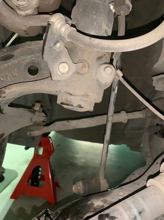 Screw holding knuckle to suspension
