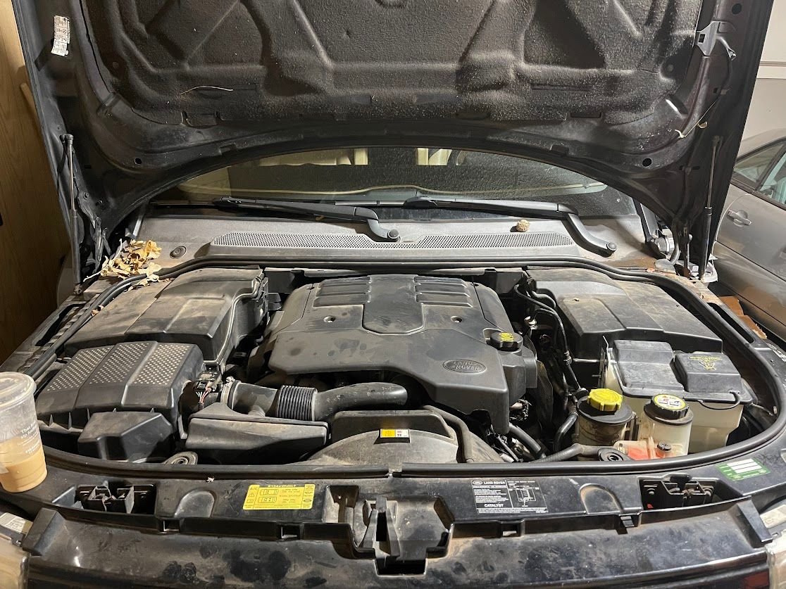 Washer fluid tank relocation with FORD Expedition parts Land Rover