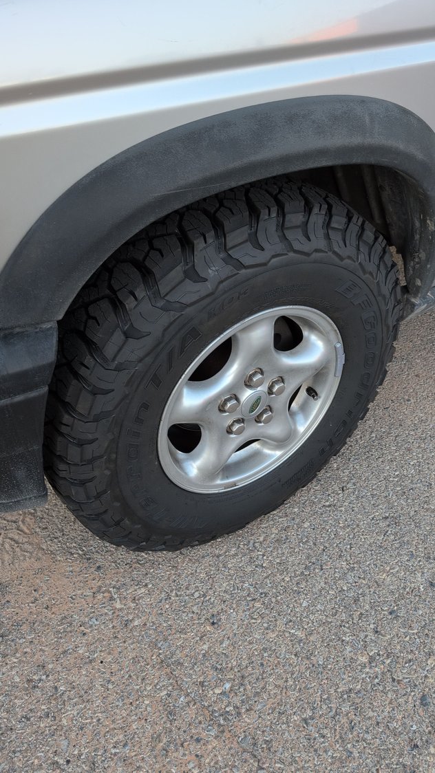 New BFG KO3 tires in 265/75/r16. There's a tiny bit of rubbing, but the planned lift will fix that. 