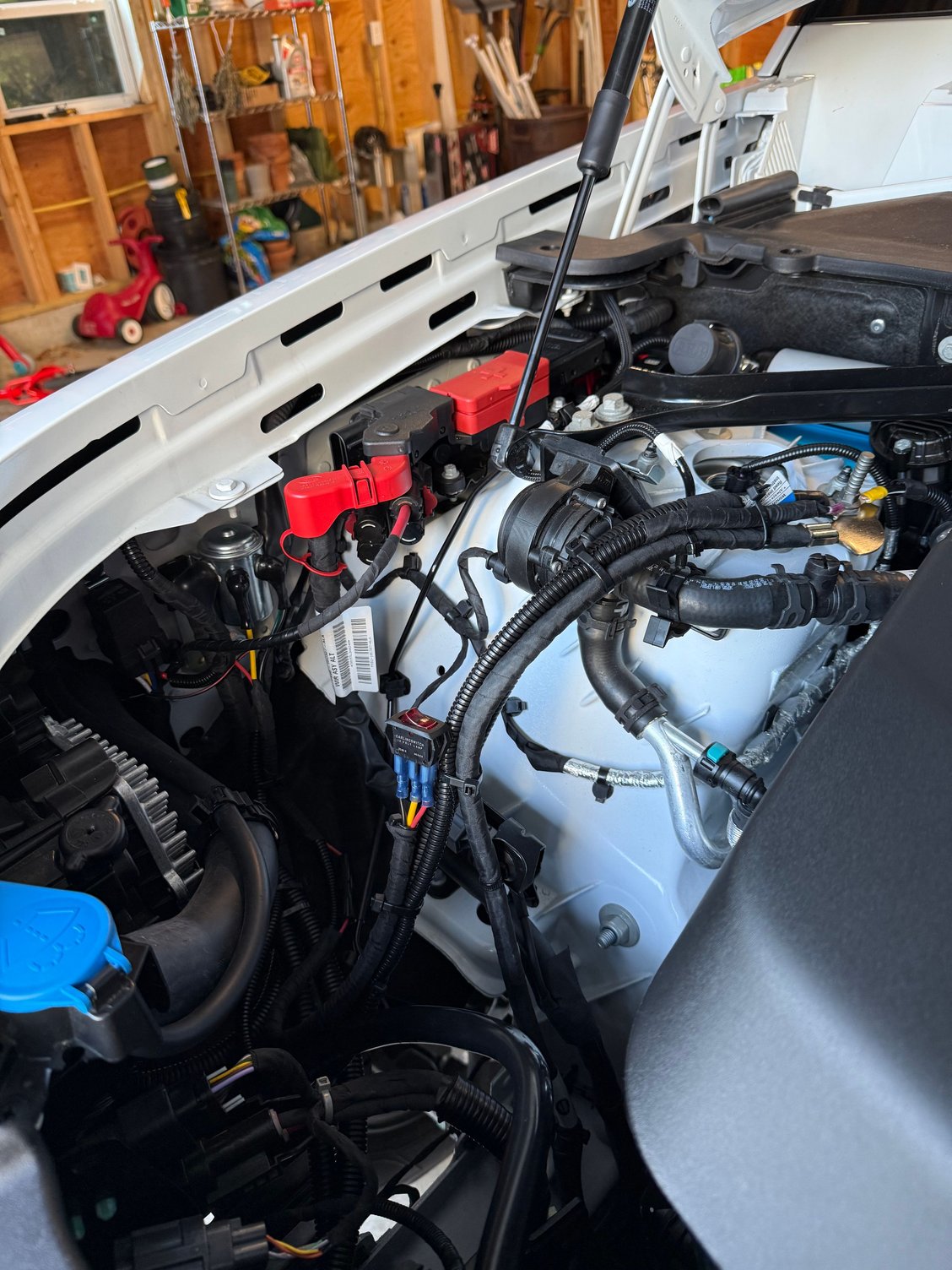 Its a little dark but on the left side you can see I added two relay's One for the fog lights and one for the winch.   Currently just a switch in engine bay for winch but will be adding a garmin or switch pro one of these days.
